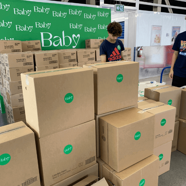 baby love volunteers with boxes